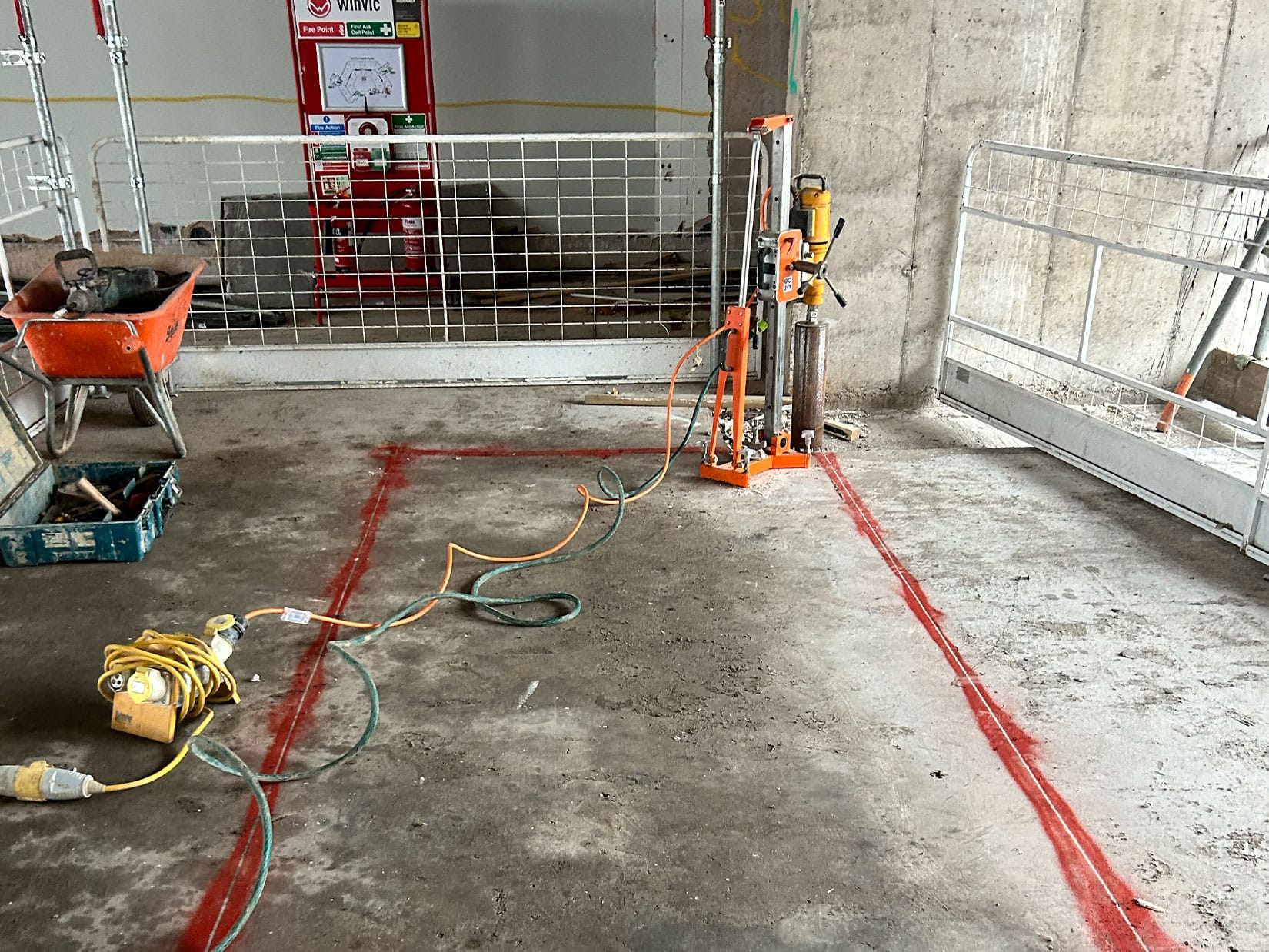 Track saw, diamond drilling and Brokk robotic demolition creating service riser openings in the old NHS building Bristol